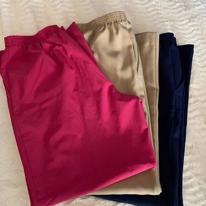 3 pairs of Alfred Dunner pants. Pink, navy and a tan color.